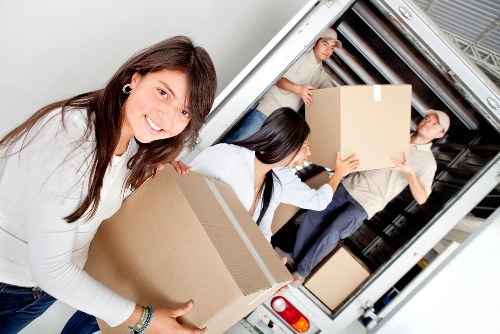 Staff using trained lifting techniques during a Southlambeth removals job
