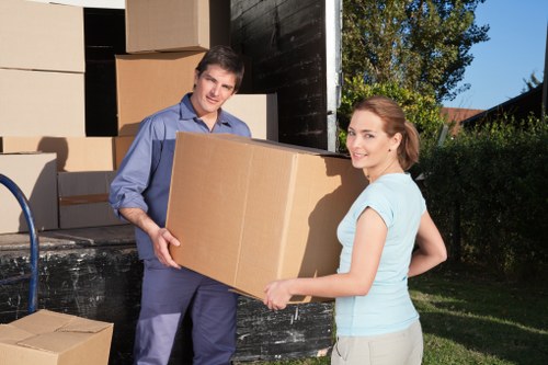 Mover handling items on stairs in a Southlambeth property